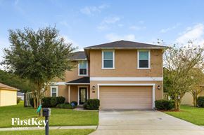 St. Augustine house for rent - a house with a driveway and a garage door