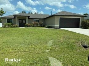 Cape Coral house for rent - a lawn in front of a house