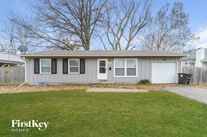 Belton house for rent - A house with a grey roof and a white door is shown with the words "FirstKey Homes" on the bottom left.