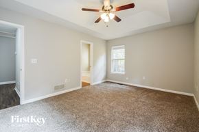 Douglasville house for rent - the master bedroom is spacious and has a ceiling fan