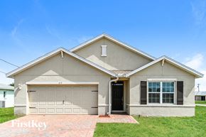 Cape Coral house for rent - A two-car garage is attached to a house.