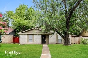 Mesquite house for rent - A house with a tree in front of it.