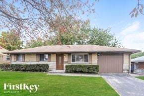 Beech Grove house for rent - A house with a brown roof and a brown garage door is for sale.
