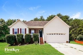 Concord house for rent - A house with a garage and a driveway is for sale.