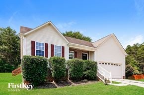Concord house for rent - A house with a red window and a sign that says Firstkey Homes.