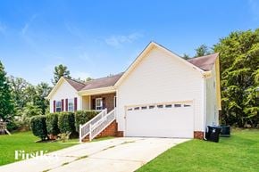Concord house for rent - A house with a white garage door and a brown roof.