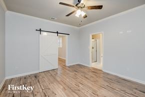 Odenville house for rent - the master bedroom has a barn door closet and hardwood flooring