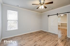 Odenville house for rent - a living room with a wood floor and a ceiling fan