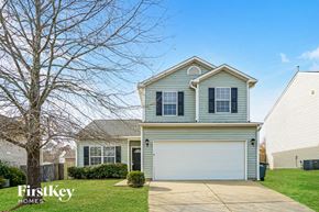 Fuquay Varina house for rent - A two-story house with a garage is for sale.