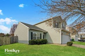 Fuquay Varina house for rent - A house with a tree in front of it.