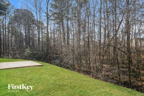 Covington house for rent - A grassy area with a FirstKey Homes logo.