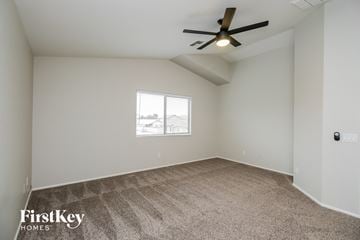 San Tan Valley house for rent - a living room with carpet and a ceiling fan