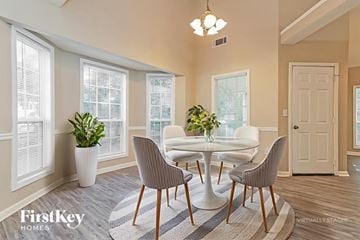 Covington house for rent - A dining room with a white table and chairs.