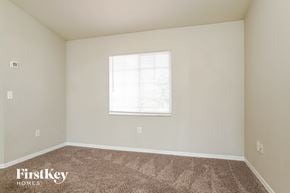 Cape Coral house for rent - a spacious room with carpet and a window