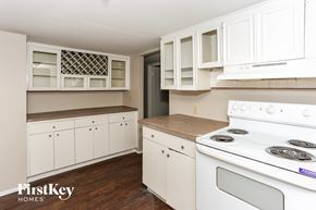 Garland house for rent - a white kitchen with white appliances and white cabinets