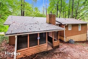 Woodstock house for rent - a view of the roof on a cabin in the woods