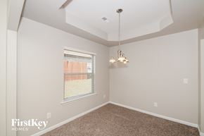 Chelsea house for rent - a bedroom with a ceiling fan and a window