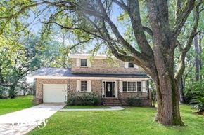 Summerville house for rent - a small brick house with a large tree in front of it