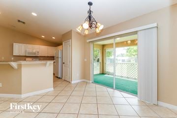 Fort Myers house for rent - A kitchen with a counter and a chandelier.