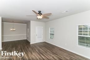 Canton house for rent - a living room with a ceiling fan and a window