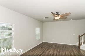 Canton house for rent - a living room with wood floors and a ceiling fan
