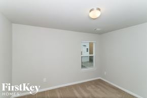 Canton house for rent - a bedroom with white walls and a window