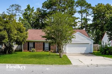 Goose Creek house for rent - a small brick house with a white garage door