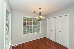Helena house for rent - a bedroom with a large window and a door to a closet