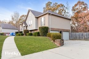 Odenville house for rent - a gray house with a yard and a white fence