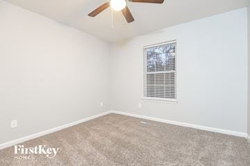 Odenville house for rent - the spacious living room with ceiling fan and carpet