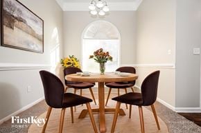 Fayetteville house for rent - A dining room with a wooden table and chairs.