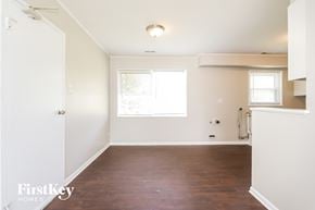 Park Forest house for rent - an empty living room with white walls and a window