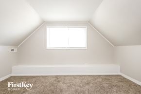 Park Forest house for rent - the upstairs bedroom with carpet and a window