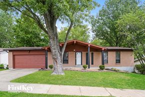Saint Louis house for rent - a small brick house with a tree in the front