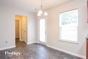 Clayton house for rent - a living room with white walls and a wood floor