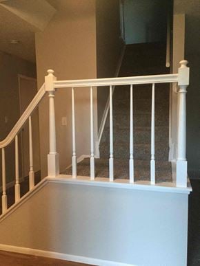 Pickerington house for rent - a white staircase with white railings and a carpeted floor
