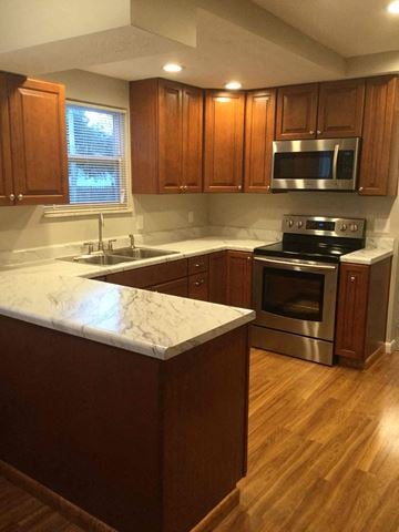 Pickerington house for rent - an updated kitchen with marble counter tops and wooden cabinets