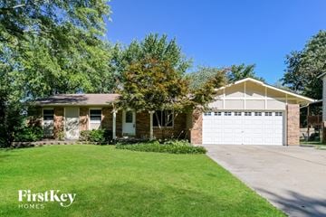Saint Charles house for rent - a small brick house with a white garage door