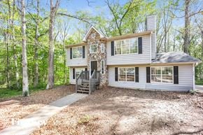 Covington house for rent - the front of a house with a driveway and a deck