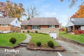 Cincinnati house for rent - a brick house with a sidewalk in front of it