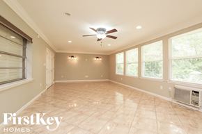 Altamonte Springs house for rent - A spacious room with a ceiling fan and tiled flooring.