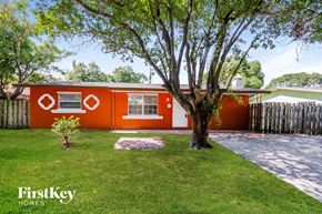 Boynton Beach house for rent - a red house with a tree in front of it