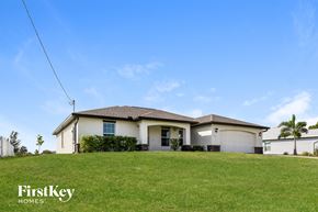 Cape Coral house for rent - a house on a hill with a green lawn