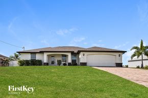 Cape Coral house for rent - a house with a lawn in front of it