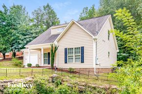 Gardendale house for rent - A house with a brown roof and a white fence.