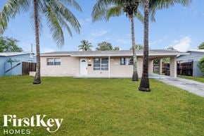 Deerfield Beach house for rent - a house with palm trees in front of it