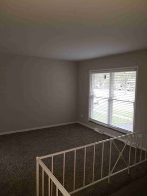 Glenwood house for rent - an empty room with a staircase and a window