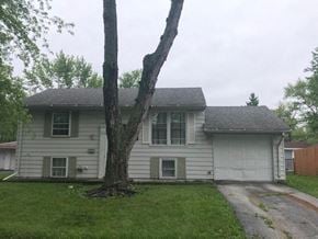 Glenwood house for rent - a white house with a tree in the yard