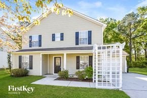 Summerville house for rent - a white house with a white fence in front of it