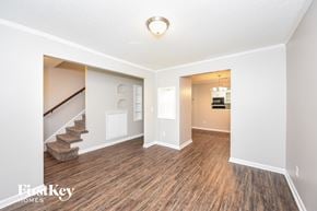 Summerville house for rent - a living room with a hard wood floor and a staircase